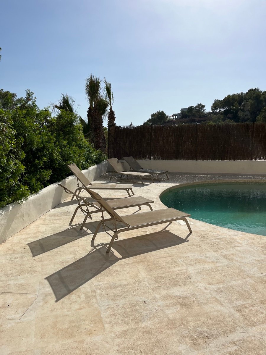 Same pool terrace after pressure washing, spotless travertine