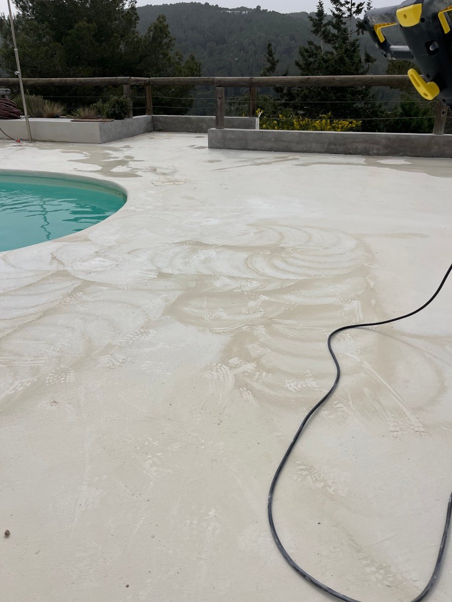 Professional cleaning machines working on a pool terrace
