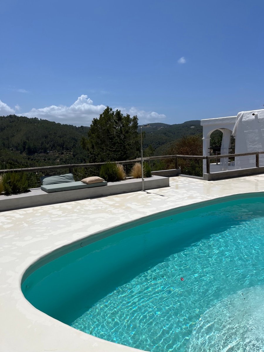 Sparkling pool and clean terrace with hill views